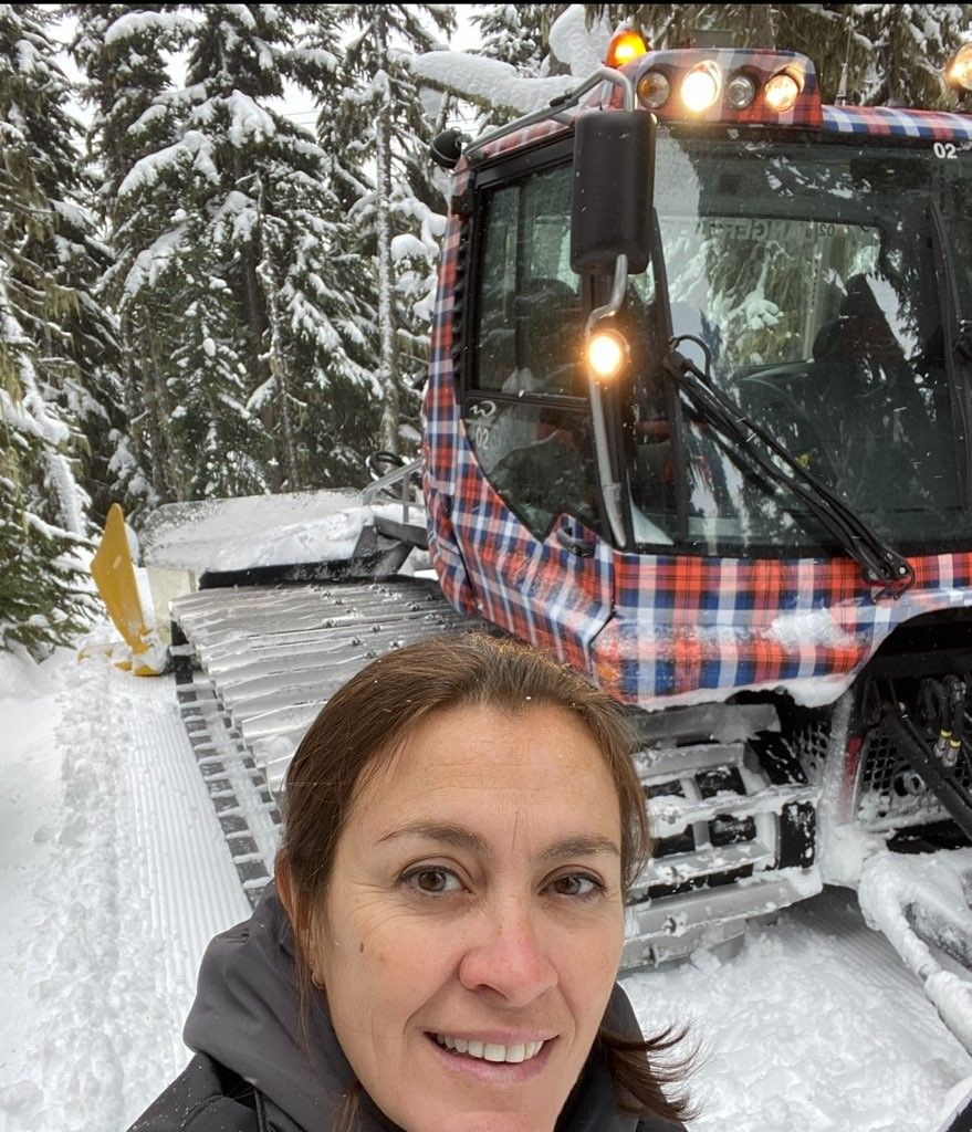 Tracy Eln with a wrapped PistenBully at Whistler Blackcomb