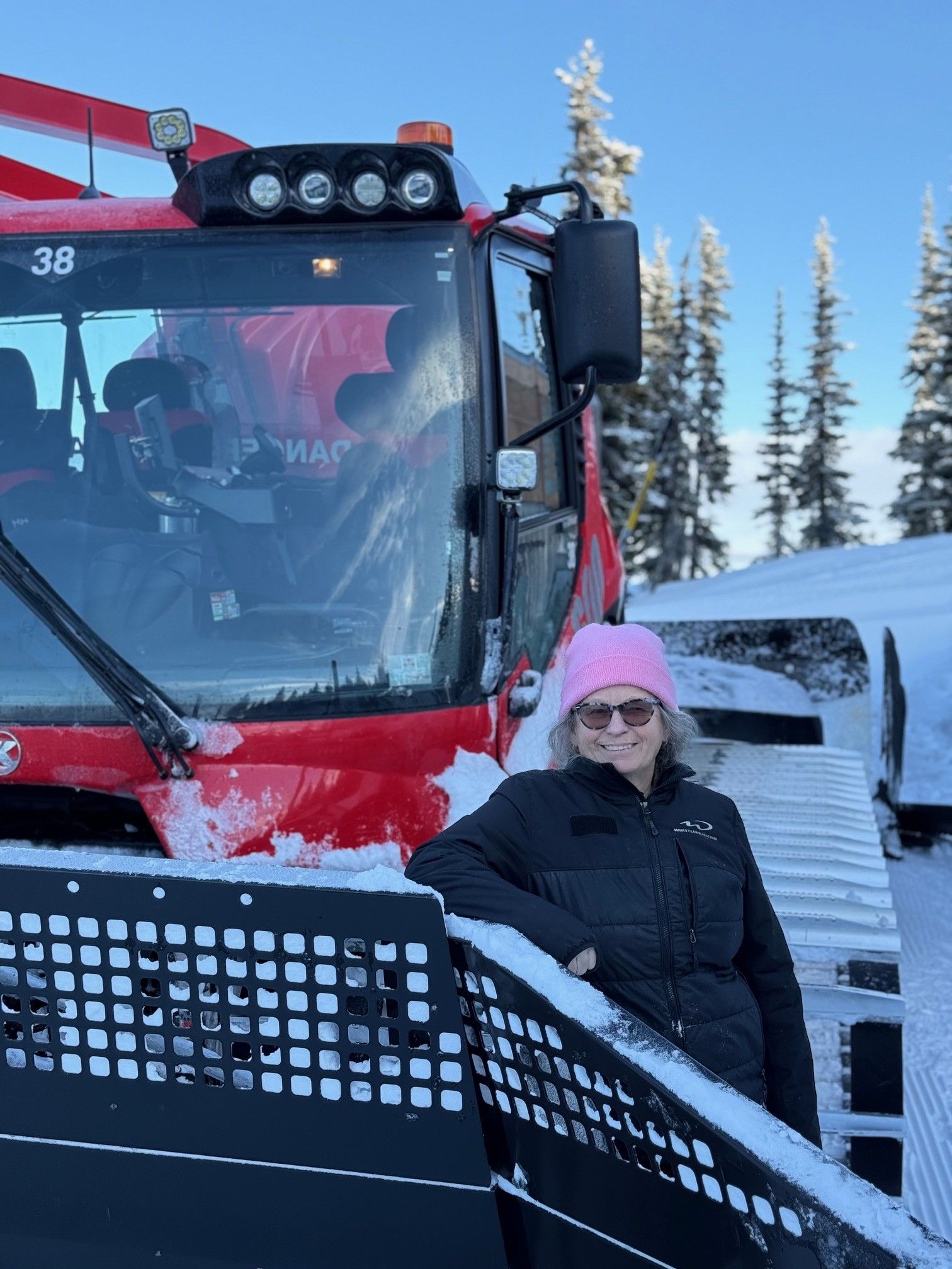 Roby Cran from Whistler Blackcomb in front of her cat.